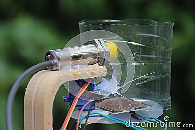 Capacitive proximity sensor with micro servo and rain sensing module working combined in detection of wet dry and metal objects Stock Photo