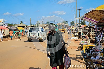 Cityscape of Local African Cape Coast town with Ghana People and Cars on the street Editorial Stock Photo