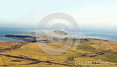 Cape Crillon in mist Stock Photo