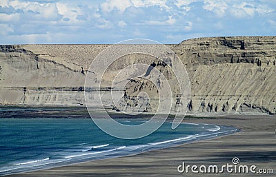 Cape with gray cliffs in the ocean Stock Photo