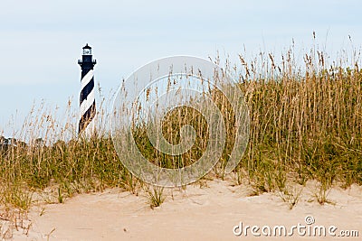 Cape Hatteras Lighthouse behind sand dunes NC USA Stock Photo