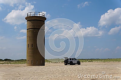 Cape Henlopen, Delaware, U.S.A - August 25, 2023 - A Jeep Wrangler drove and passed the World War II tower on the beach Editorial Stock Photo
