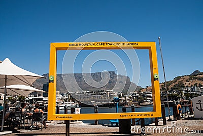 Yellow Table Mountain photo frame in V&A Waterfront Editorial Stock Photo