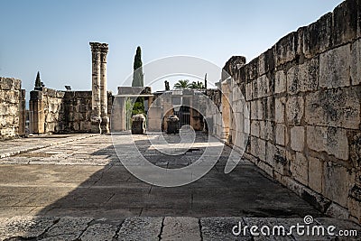 Capernaum synagogue columns with a blue sky in the background, Israel Editorial Stock Photo
