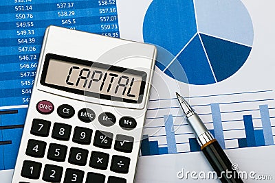 Capital on calculator Stock Photo