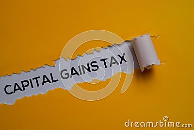Capital Gains Tax Text written in torn paper Stock Photo
