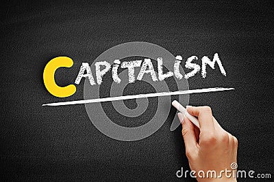 Capitalism text on blackboard Stock Photo