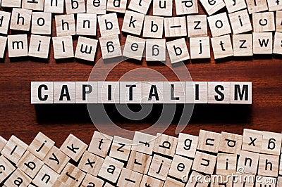 Capitalism word concept on cubes Stock Photo
