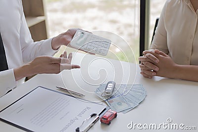 The capitalist has rented a car for the tenant and the tenant has made a deposit as collatera Stock Photo