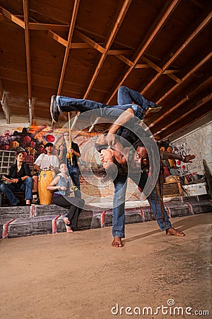 Capoeira Artists Flipping Stock Photo