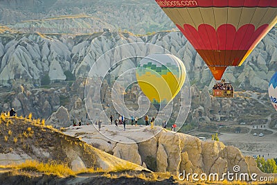 13.10.2022. Cappadocia, Turkey. gorgeous view of flying air balloons over Cappadocia at sunrise and lots of people Editorial Stock Photo