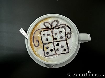 Cappuccino with box gift shape decoration Stock Photo