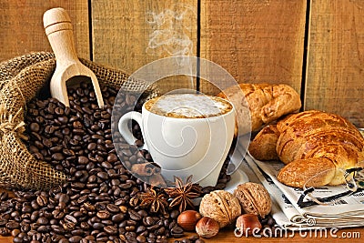 Cappuccino, brioches and newspaper with background Stock Photo