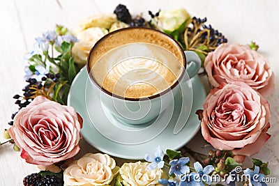 Cappuccino coffee and flowers composition on white wood Stock Photo
