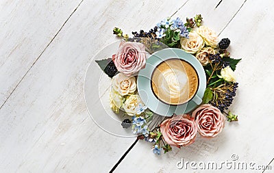 Cappuccino coffee and flowers composition on white wood Stock Photo