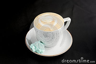 Cappuccino coffee in a white cup on black background. Copy space banner, coffee time Stock Photo