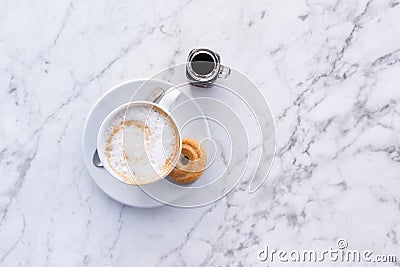 Cappuccino cup and biscotti top down view, italian coffee, cafe. Stock Photo