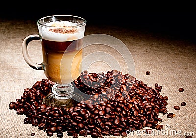 Cappuccino glass with coffee beans Stock Photo