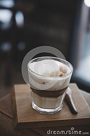 Cappuccino or Latte art coffee made from milk on the wood table in coffee shop Stock Photo