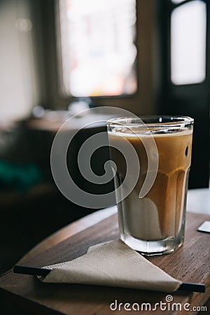 cappuccino or Latte ice coffee made from milk on the wooden table in coffee shop Stock Photo