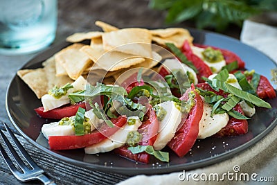 Fresh Pesto Caprese Salad with Pita Chipas Stock Photo