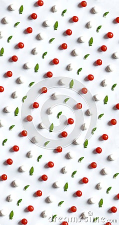 Caprese salad ingredients in rows. Top view of tomatoes, mozzarella cheese and fresh green leaves. Food photobomb perfect pattern Stock Photo