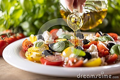 Caprese salad is oiled with olive oil Stock Photo