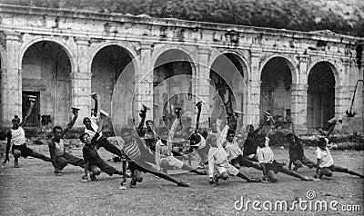 Capri, Itali, 1927 - Young Italians do gymnastic exercises in the Certosa of Capri during the fascism Editorial Stock Photo