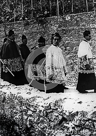 Capri, Italy, 1929 - Some religious parade in cassock with candles during the celebrations of San Costanzo, patron of the island Editorial Stock Photo