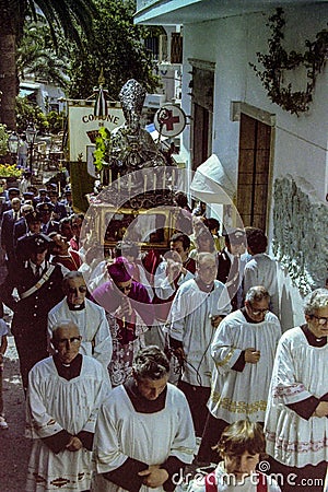 CAPRI, ITALY, 1974 - The traditional procession of San Costanzo with the statue of the saint runs through the streets of Capri Editorial Stock Photo