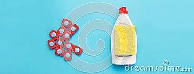 Capsules for dishwashers, dishwashing liquid and sponges on a blue background. dishwasher vs hand wash concept.banner Stock Photo