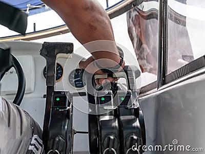 Captain control hand throttle on speedboat Stock Photo