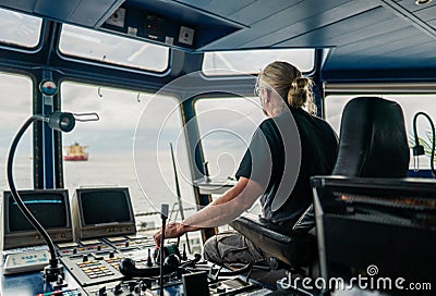 Captain of deck Officer on bridge of vessel or ship during navigaton watch at sea Stock Photo