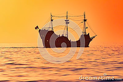 Captain Memo`s Pirate Cruise on colorful sunset background in Gulf Coast Beaches. Editorial Stock Photo