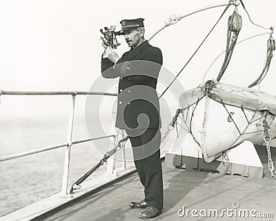 Captain navigating ship Stock Photo