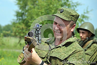 The captain of the Russian armed forces tells the soldiers about the device of the grenade launcher Editorial Stock Photo