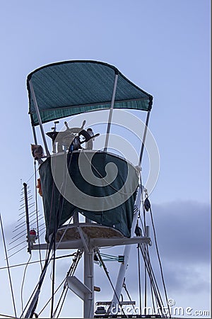 A captain`s bridge with awning of a fishing boat Stock Photo