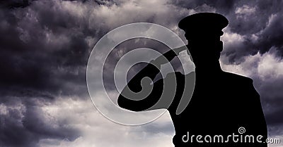 Captain silhouette saluting against storm clouds Stock Photo