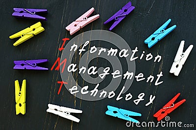 The caption in the picture is Information Management Technology IMT. Notebook sheet, pens Stock Photo