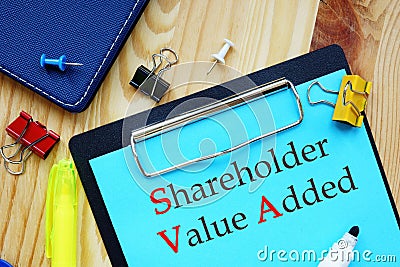 The caption in the picture is Shareholder Value Added SVA. Notebook sheet, pens Stock Photo