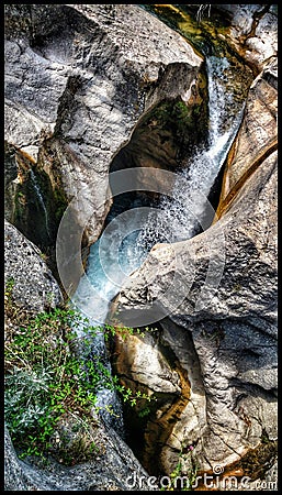 Captivating detail of a cascading river over beautiful rock formations in the picturesque landscapes of Southern France Stock Photo