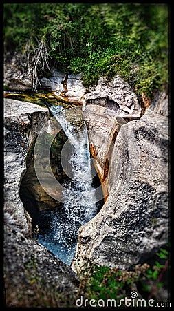 Captivating detail of a cascading river over beautiful rock formations in the picturesque landscapes of Southern France Stock Photo