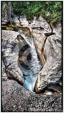 Captivating detail of a cascading river over beautiful rock formations in the picturesque landscapes of Southern France Stock Photo