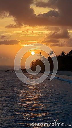 Capture the serenity of a tropical coastline at sunset Stock Photo