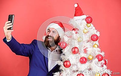 Capturing christmas memories. Man with beard and happy face send christmas greetings. Winter holidays concept. Santa Stock Photo