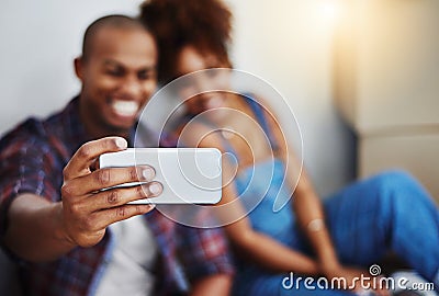 Capturing our first moments together in the new place. an attractive young couple moving house. Stock Photo