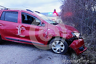 Car accident. The car crashed on the road . Crashed red car. Real event. Stock Photo