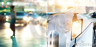 Car accident causes traffic jams in colorful light and rain on city street Stock Photo