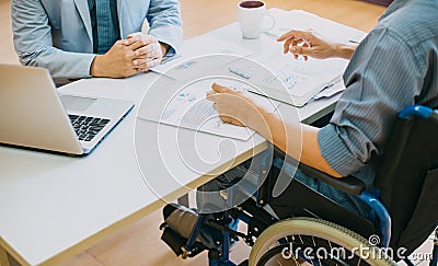 After car accident and rehabilitation, a businessman can return to work again.The company which employing disable people will rece Stock Photo