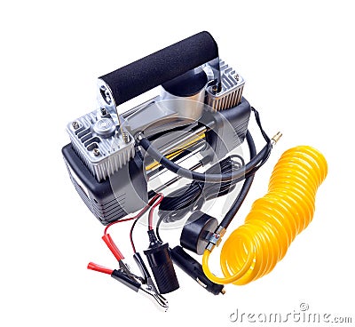 Car air compressor with yellow twisted hose for supplying compressed air on an isolated white Stock Photo